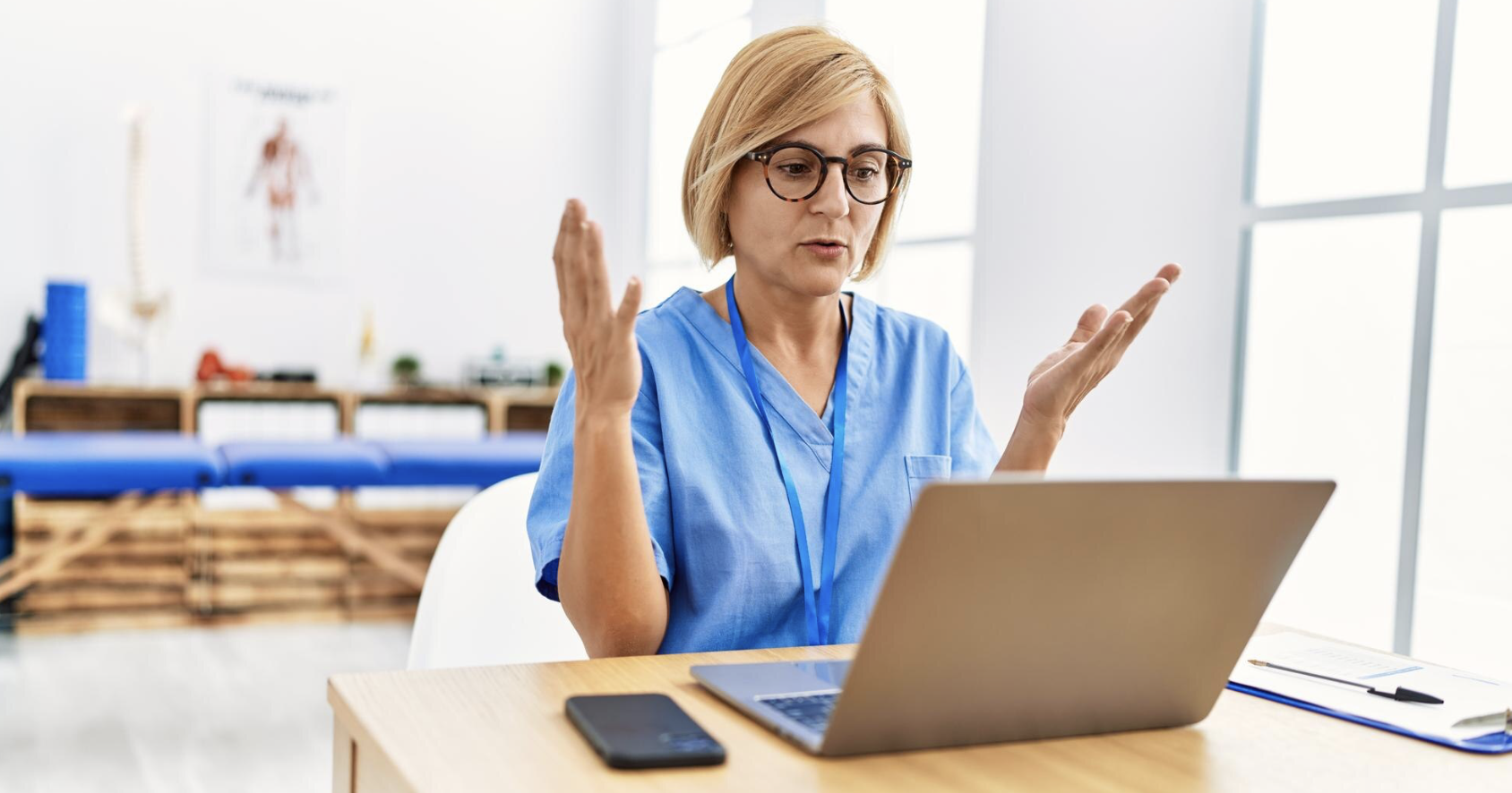 HIPAA compliance doctor looking confused at computer